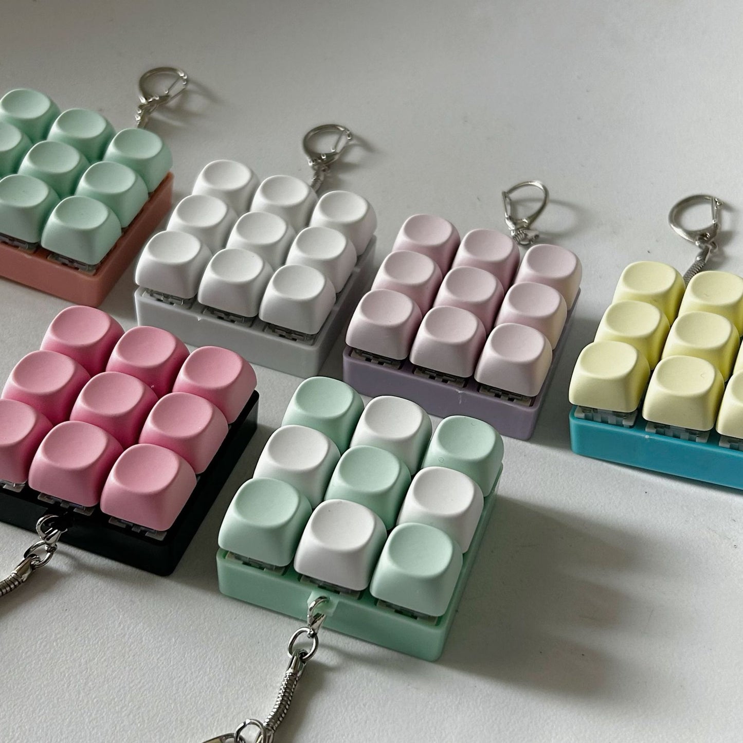 2-Pack Light Pink Mechanical 9-Keyboard Fingertip Toy Keychain - Key Pressure Relief, PVC Fingertip Toy